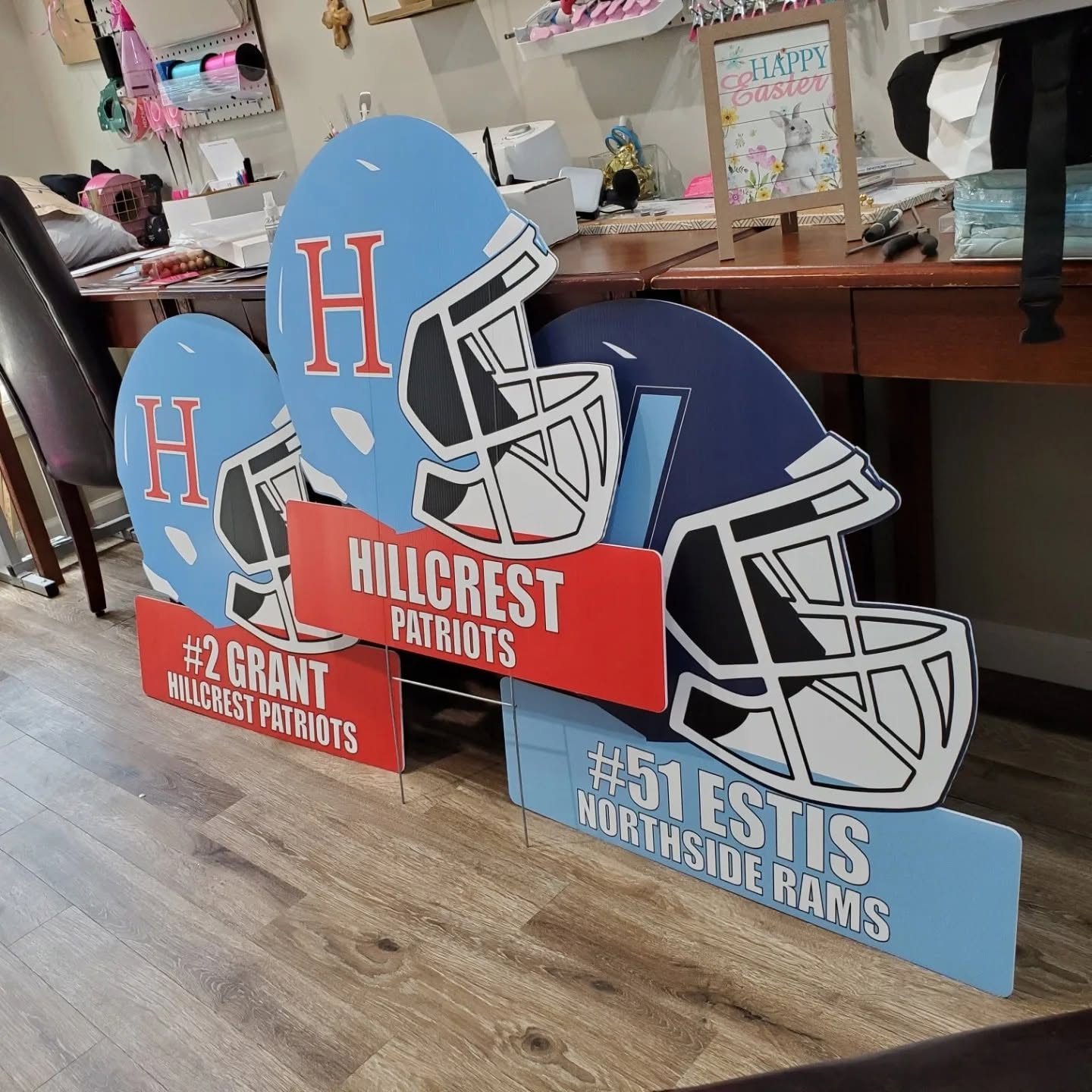 Oversized 28-inch contour-shaped football helmet yard signs made of weather-proof corrugated plastic with custom team themes and personalization